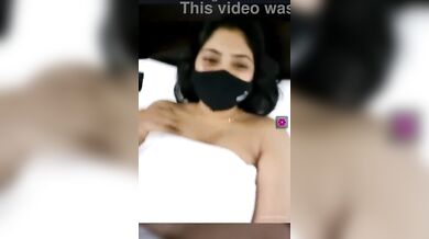 Indian girl in courtship lowers towel while video call