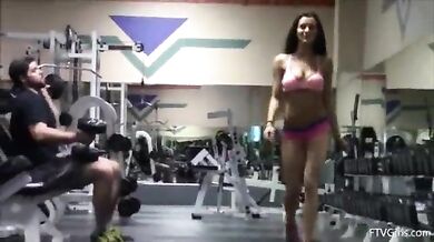Public gym teasing girl wearing pink bra and panties