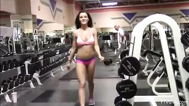 Public gym teasing girl wearing pink bra and panties