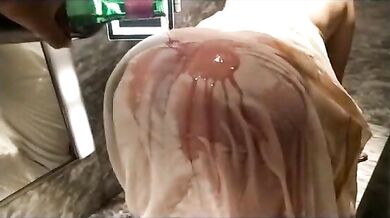 Wife seducing her husband pouring wine on her