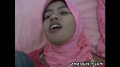 A guy fucks his Indonesian GF and cums on her
