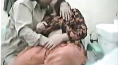 Pakistani doctor fucks a busty milf in his clinic